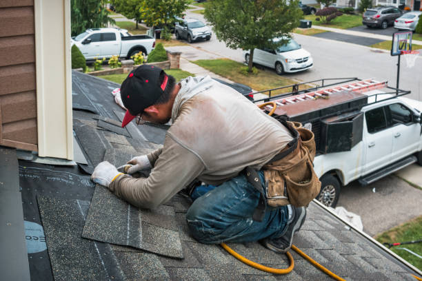 Professional Storm Damage Roof Repair technician working in Magee, MS